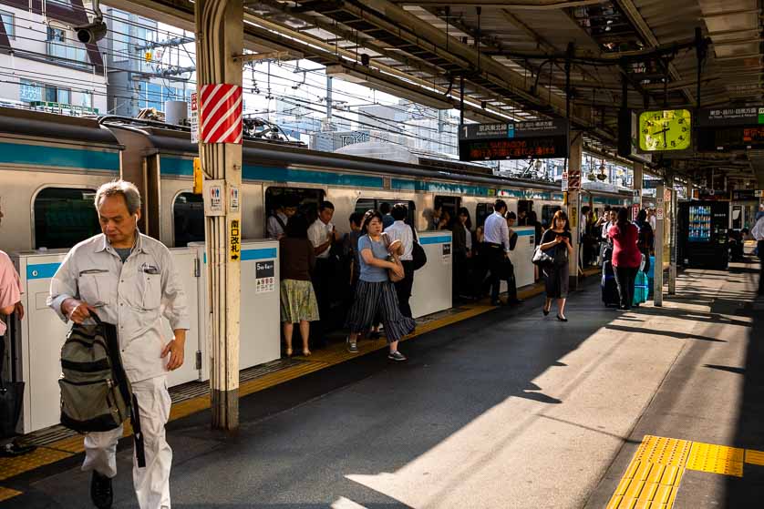 Commuters alighting at JR Okachimachi Station, Ueno, Taito-ku, Tokyo, Japan.