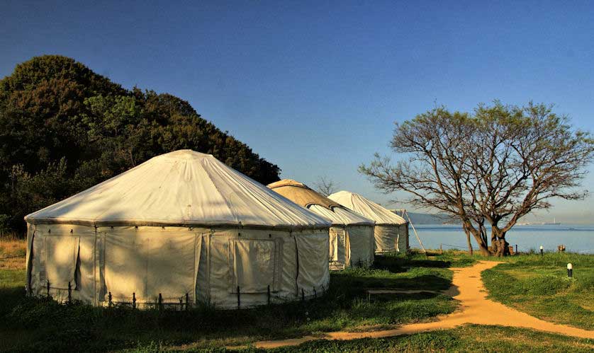 Yurts on the beach on Naoshima at sunrise.
