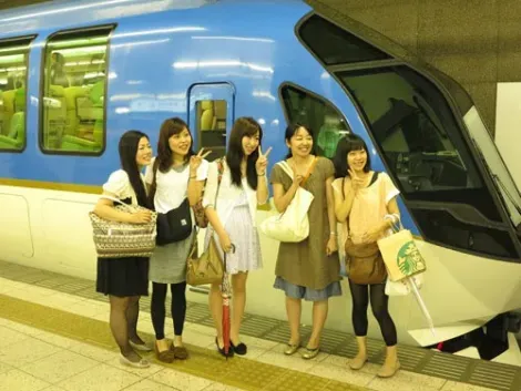 Fans gather for a photo opportunity in front of the train at Kintetsu Nagoya Station
