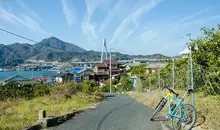A small fishing village and a view of Kurushima bridge along the Shimanami Kaido.