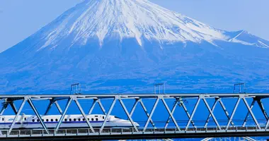 The Shinkansen bullet train going past Mount Fuji