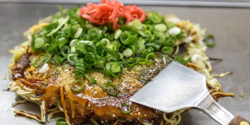 Traditional Japanese okonomiyaki, savory pancake