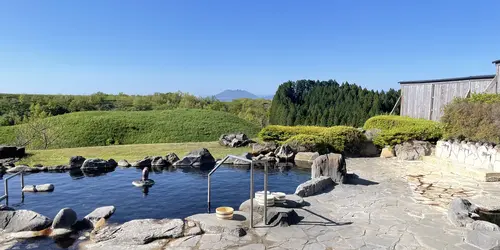 Outdoor swimming pool with a view of Mount Aso